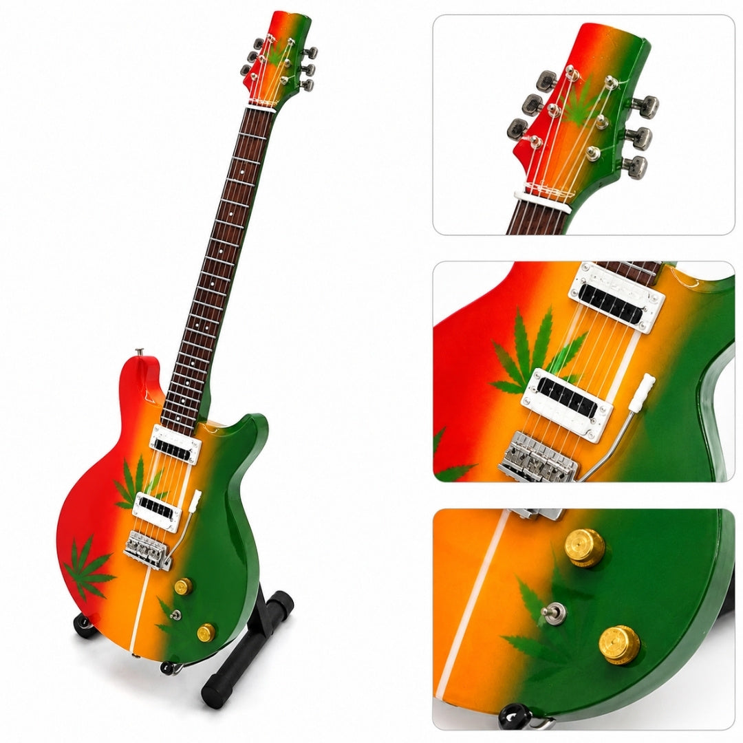Mini chitară Bob Marley Tribute Ganja MGT-0468 cu posibilitate de personalizare prin gravură, cadou ideal pentru fanii reggae, realizată manual din lemn de mahon, înălțime 27,5 cm, culoare galben, roșu, verde, alb