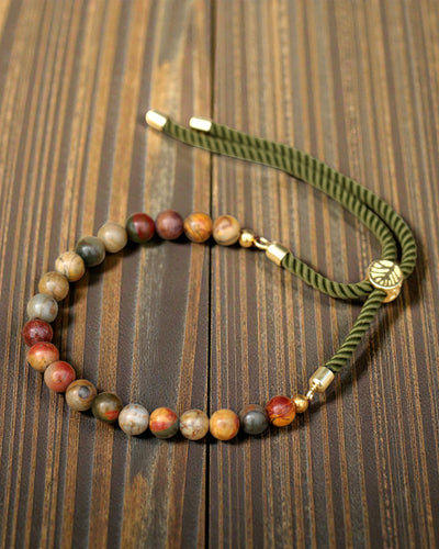 Moss Aura – Brățară cu jasp Picasso și aur de 18K pe șnur verde