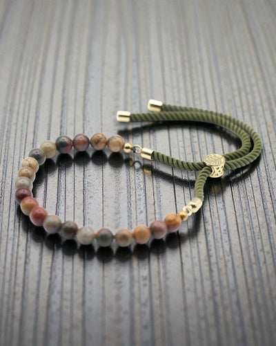 Moss Aura – Brățară cu jasp Picasso și aur de 18K pe șnur verde