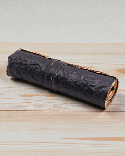 Jurnal de călătorie Nomad din piele, rulabil, negru – 21 × 15 cm